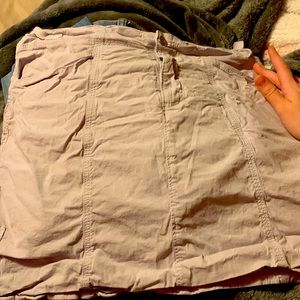 White skirt. With retractable straps inside. Built in shorts. And comfortable.